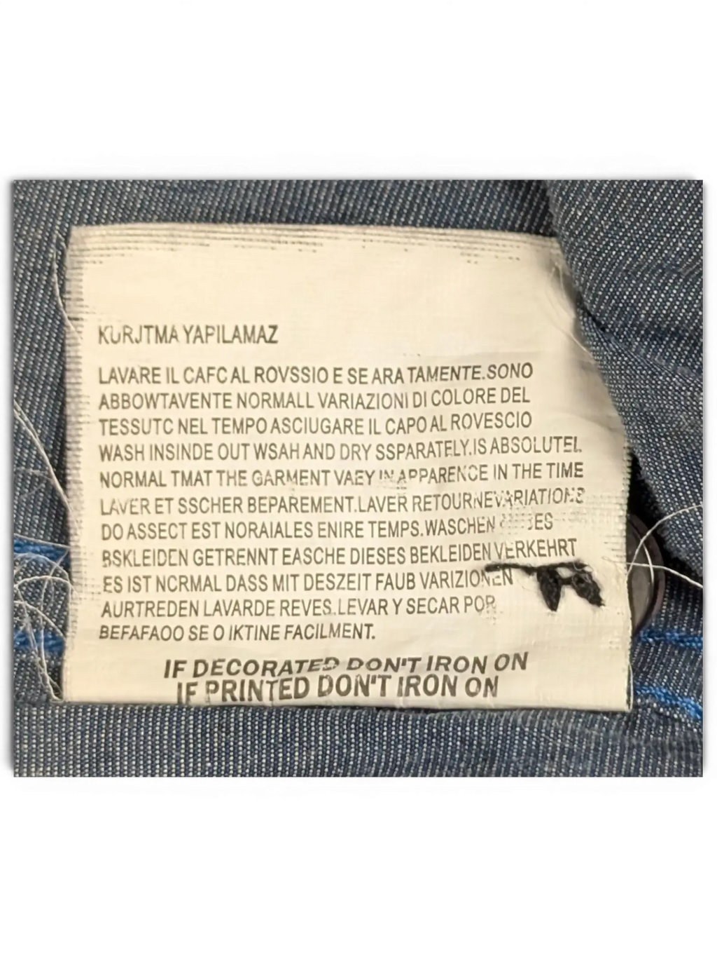 JAKE & IPI Diesel charcoal grey shirt care label with multi-language washing instructions