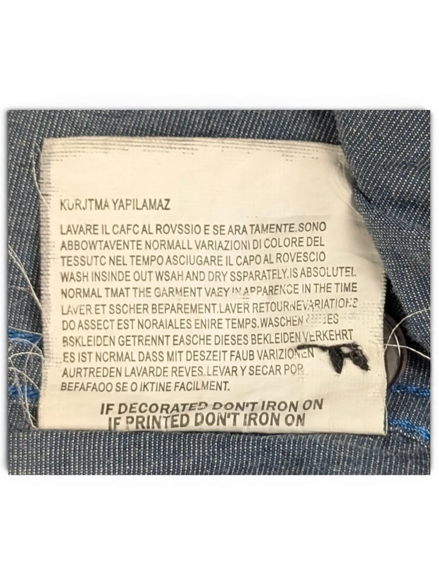 JAKE & IPI Diesel charcoal grey shirt care label with multi-language washing instructions