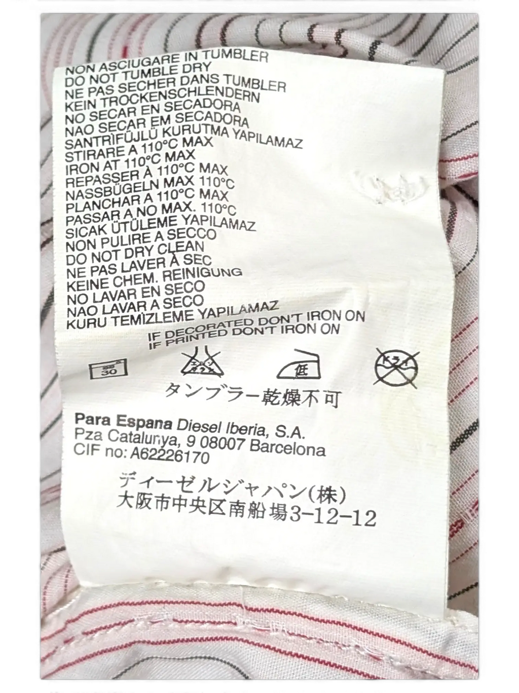 JAKE & IPI vintage Diesel short sleeve shirt featuring white, grey, and pink fine stripes and care label details.