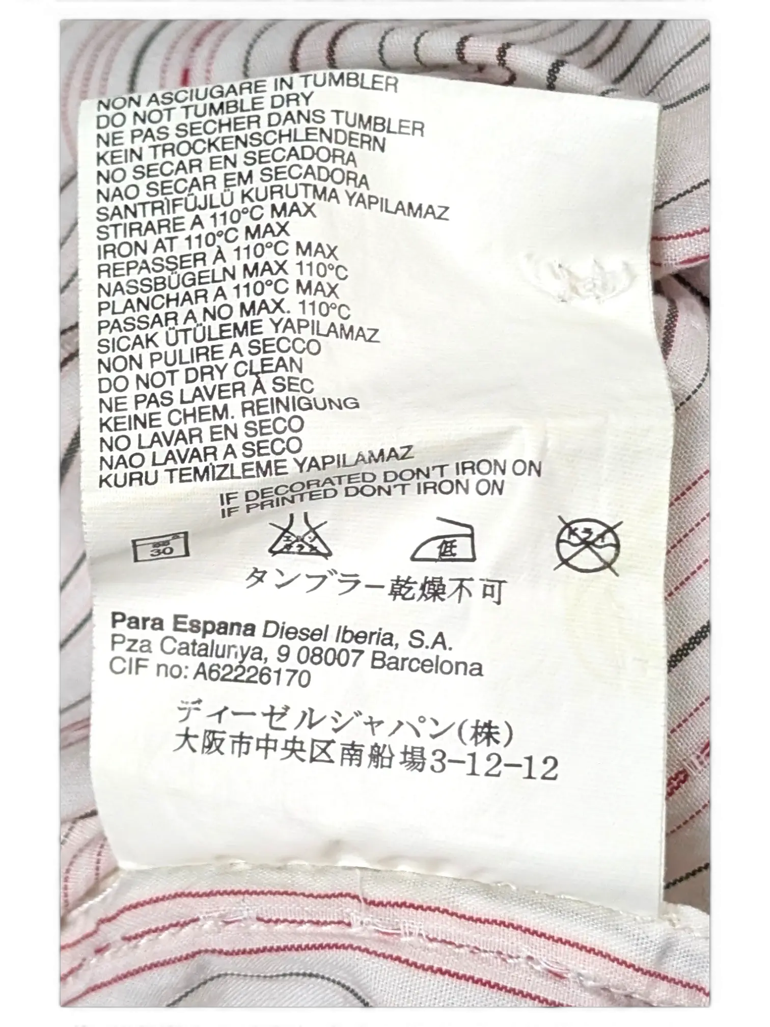 JAKE & IPI vintage Diesel short sleeve shirt featuring white, grey, and pink fine stripes and care label details.