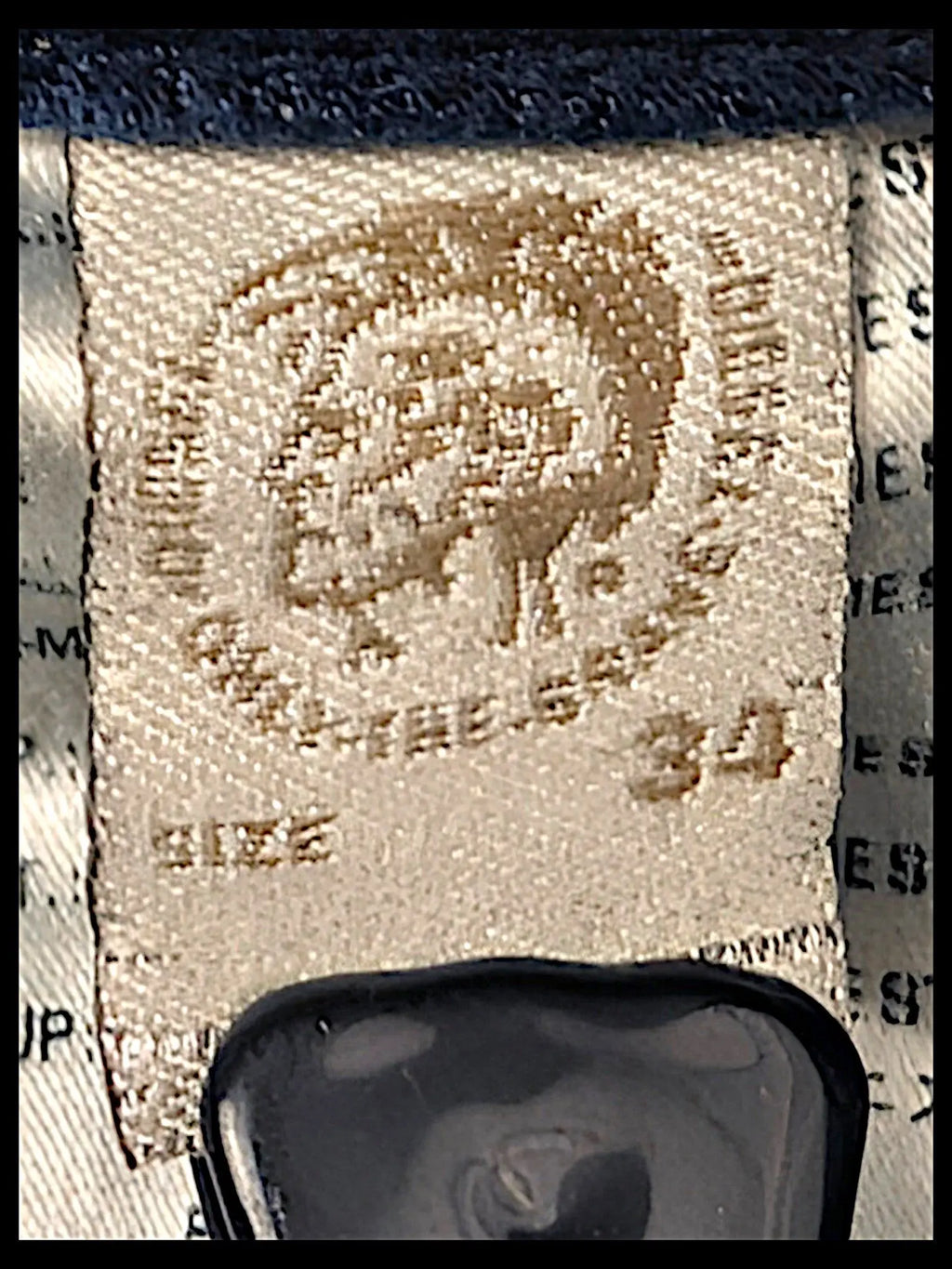 JAKE & IPI Diesel Thavar jeans interior care label with brand logo and size 34 tag