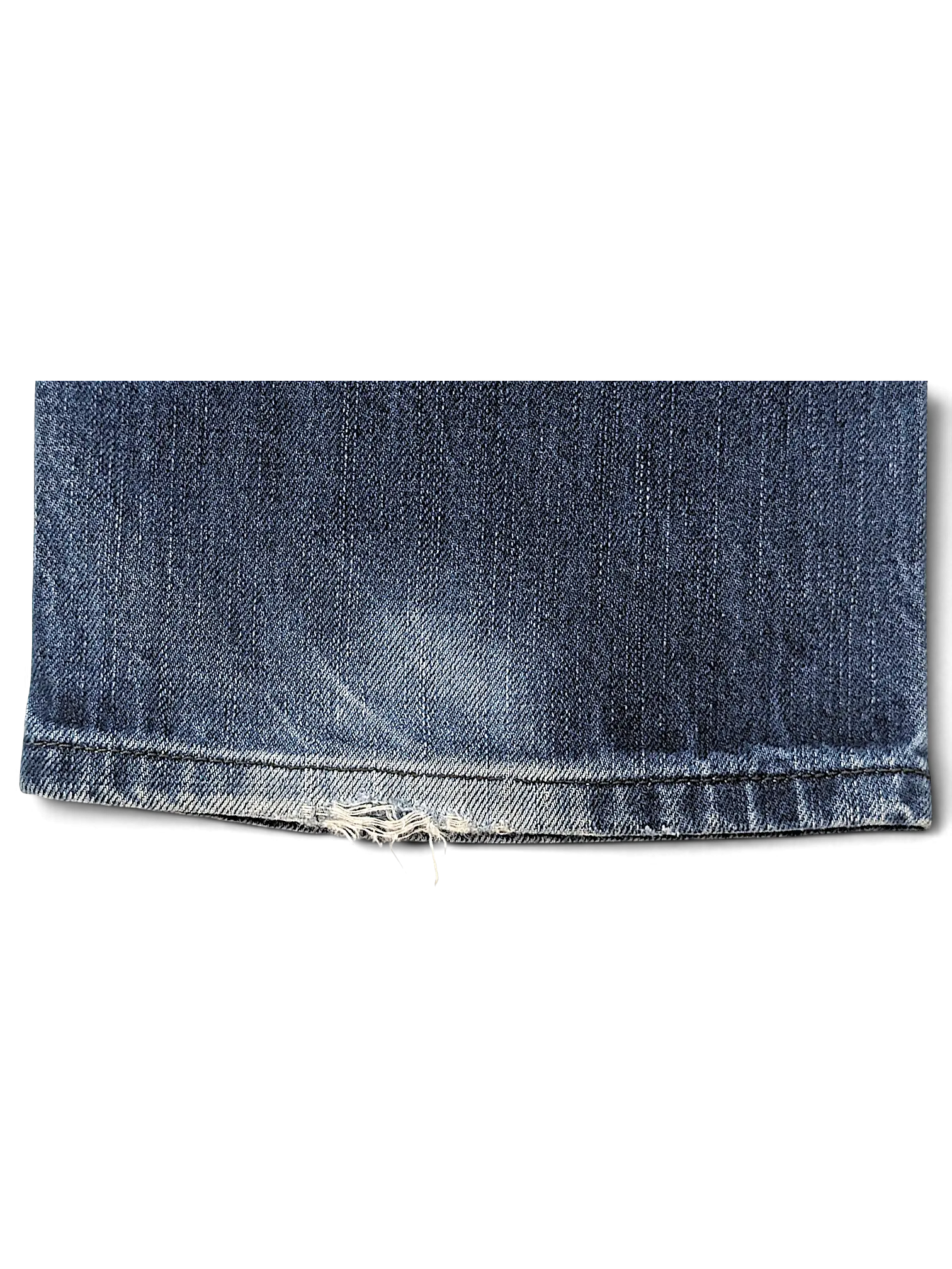 JAKE & IPI Diesel Vikerback jeans hem detail showing blue denim fabric with light distressing and frayed edges