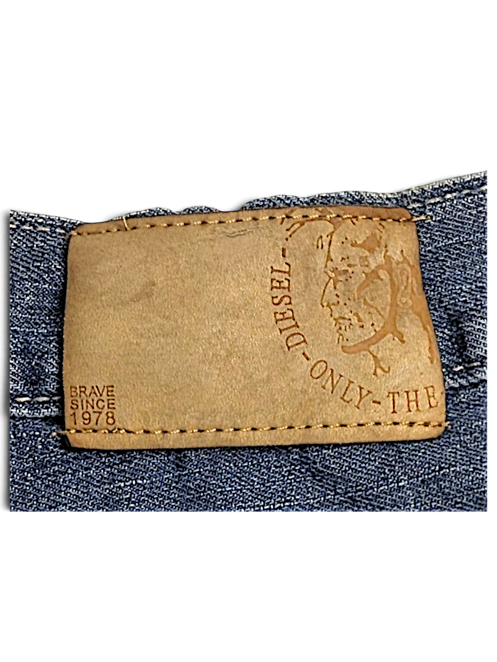 JAKE & IPI Diesel vintage blue jeans featuring a tan leather brand patch with embossed logo and Brave Since 1978 text