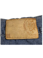 JAKE & IPI Diesel vintage blue jeans featuring a tan leather brand patch with embossed logo and Brave Since 1978 text
