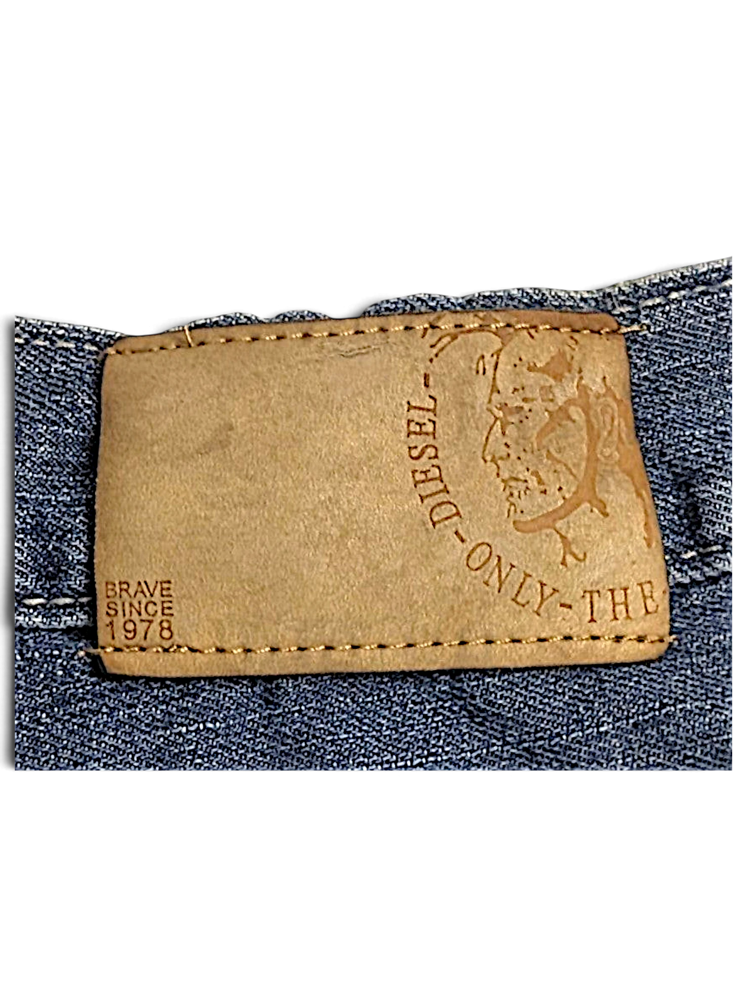 JAKE & IPI Diesel vintage blue jeans featuring a tan leather brand patch with embossed logo and Brave Since 1978 text