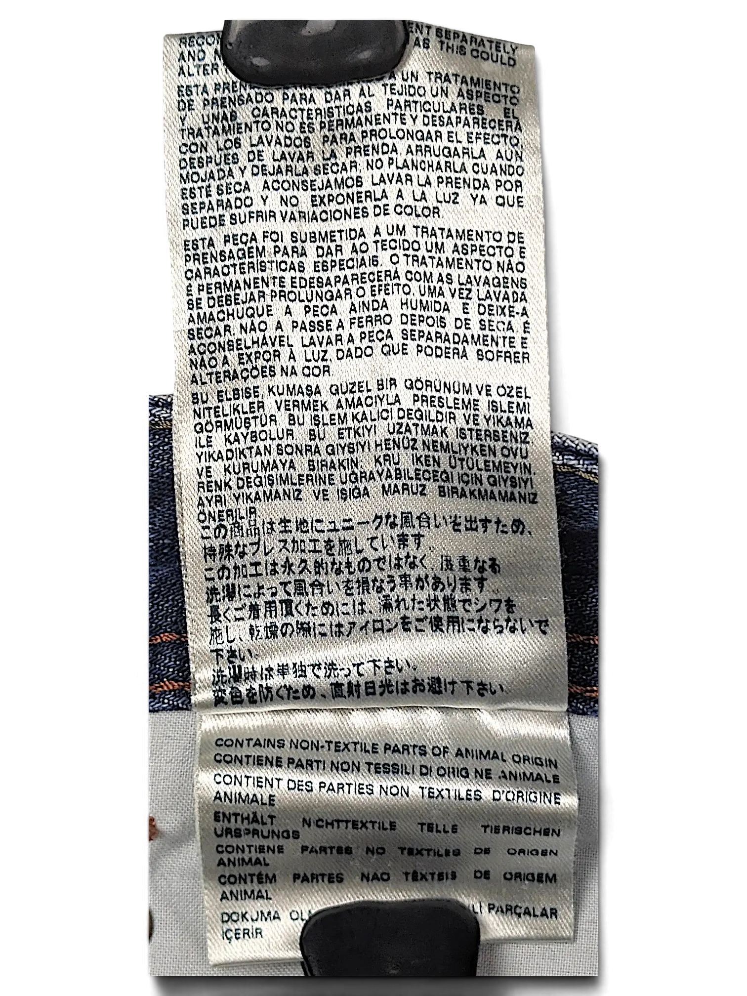 JAKE & IPI Diesel Waykee jeans care label with multi-language washing instructions and denim fabric detail