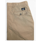 JAKE & IPI pre-owned beige Dockers cotton pleated chinos with a buttoned back pocket detail.