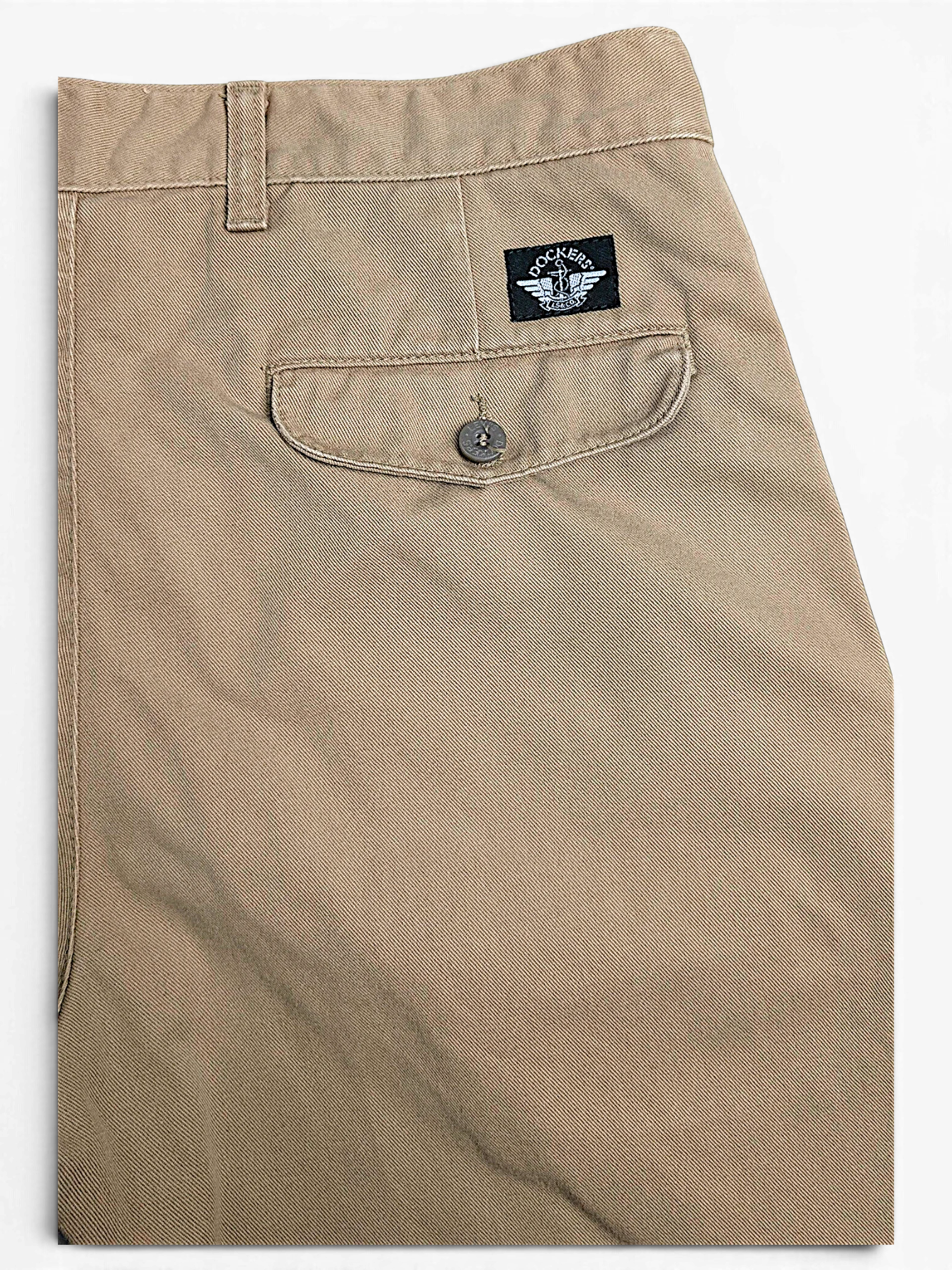 JAKE & IPI pre-owned beige Dockers cotton pleated chinos with a buttoned back pocket detail.