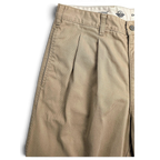 JAKE & IPI pre-owned Dockers beige cotton pleated chinos with a relaxed fit and visible wear.