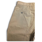 JAKE & IPI pre-owned Dockers beige cotton pleated chinos featuring a buttoned back pocket detail