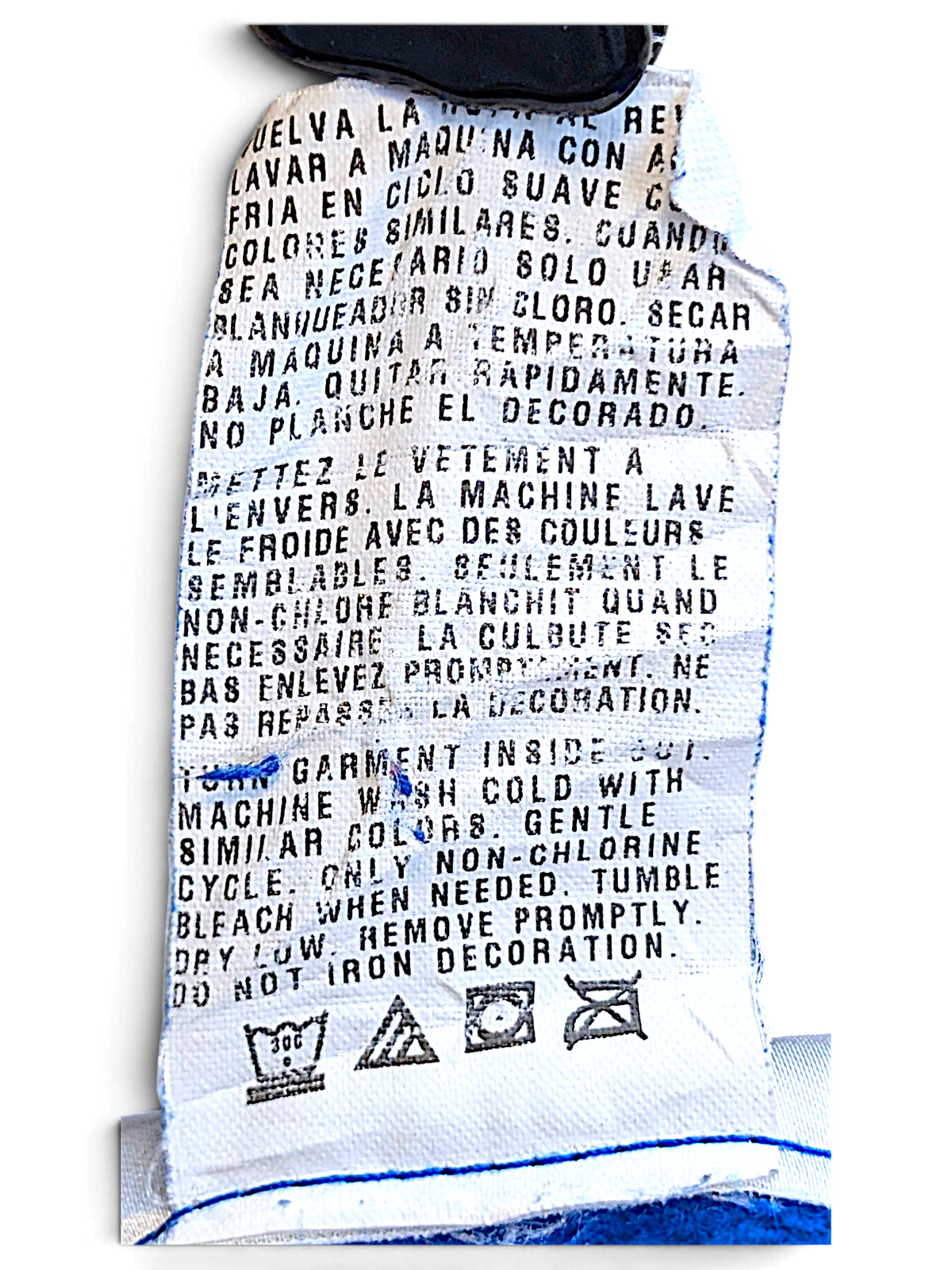 JAKE & IPI Donald Duck hoodie care label with washing instructions in English, French, and Spanish