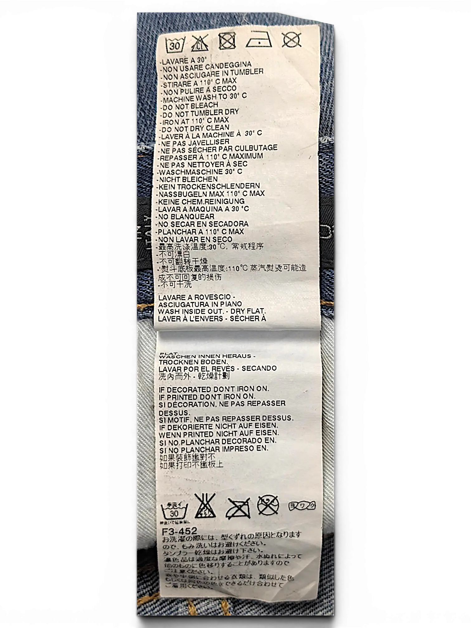 JAKE & IPI Dsquared² jeans care label with washing instructions in multiple languages on white fabric tag