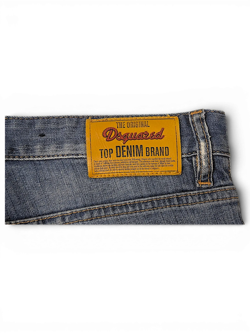 JAKE & IPI Dsquared2 blue denim jeans featuring a prominent yellow leather brand patch on the back waistband