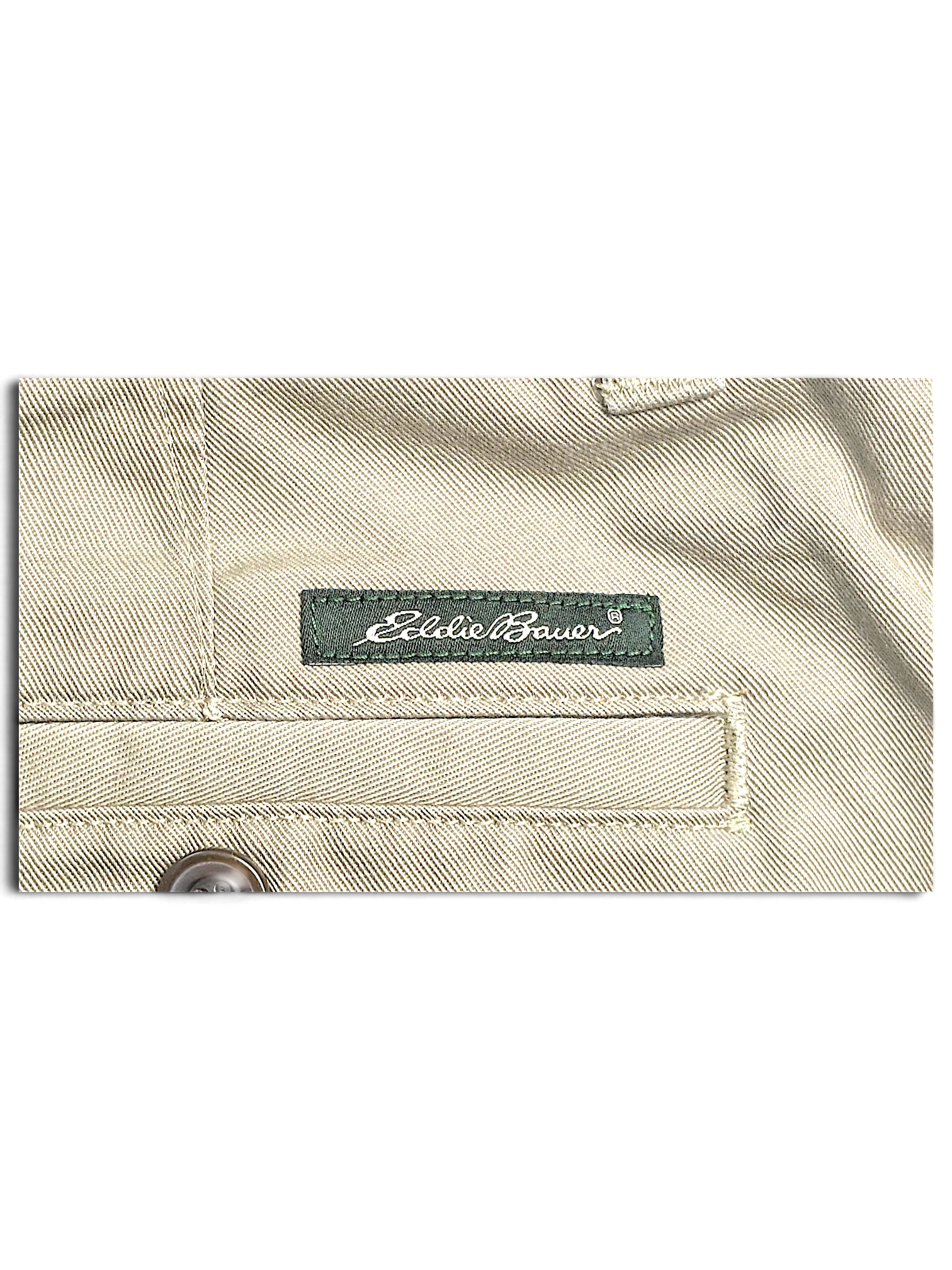 JAKE & IPI Eddie Bauer beige cotton chino pants featuring a branded green fabric label and stitched pocket detail