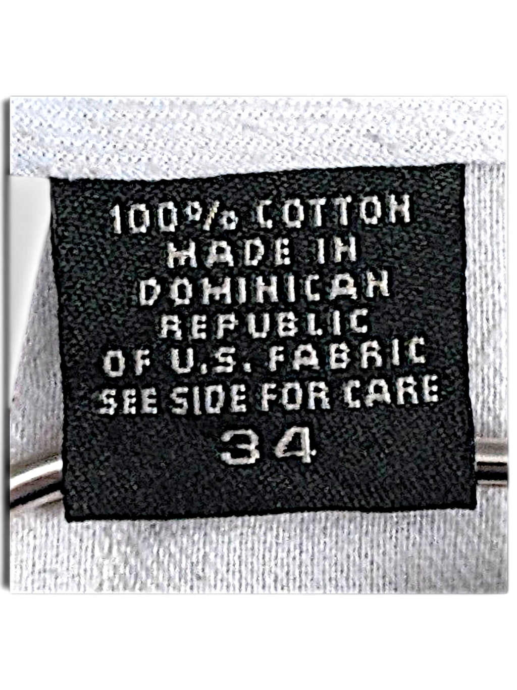 JAKE & IPI Eddie Bauer clothing label showing 100% cotton composition and size 34