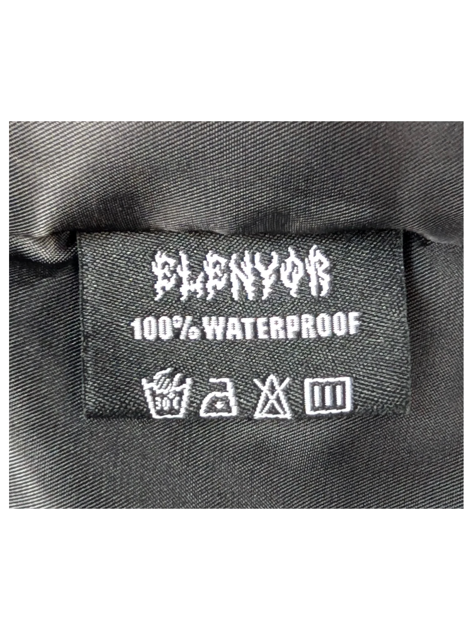 JAKE & IPI Elenyor jacket black interior label with 100% waterproof text and care instructions