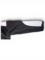 JAKE & IPI IBE Elenyor jacket sleeve featuring black and white color-blocked design with reflective piping detail.