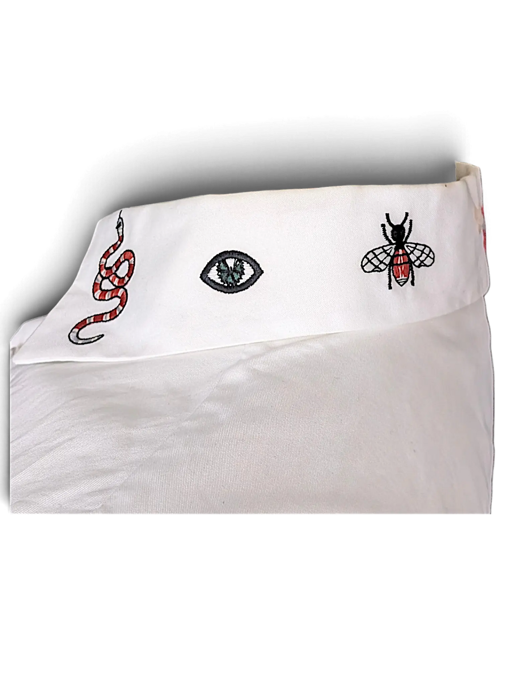 JAKE & IPI white cotton shirt collar featuring embroidered snake, eye, and bee motifs