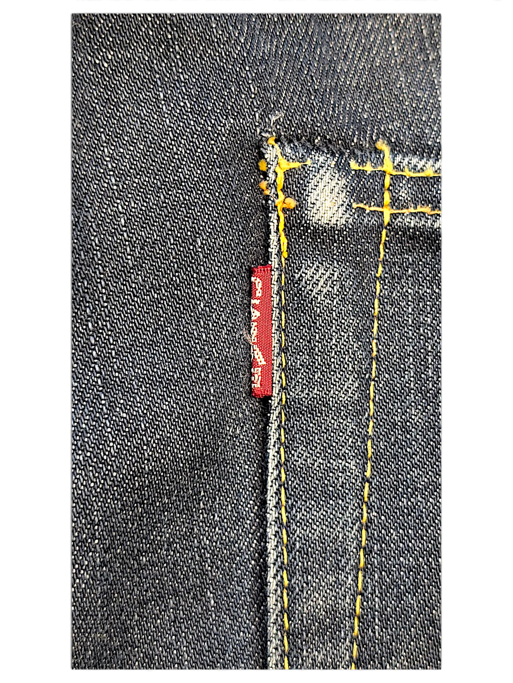 JAKE & IPI IBE Evisu One Of One dark denim jeans featuring contrast yellow stitching and a red woven brand tab