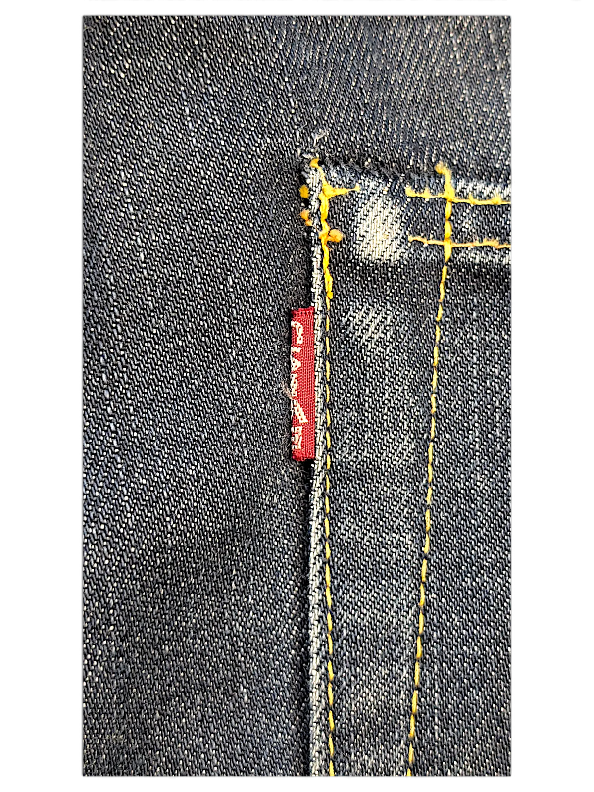 JAKE & IPI IBE Evisu One Of One dark denim jeans featuring contrast yellow stitching and a red woven brand tab