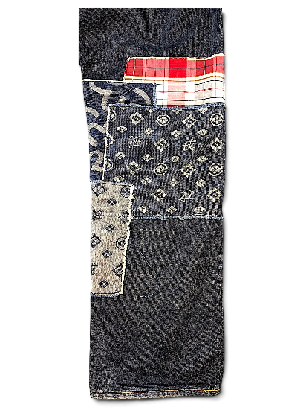 JAKE & IPI Evisu one of one jeans featuring dark denim with patchwork details, plaid accents, and monogram patterns.