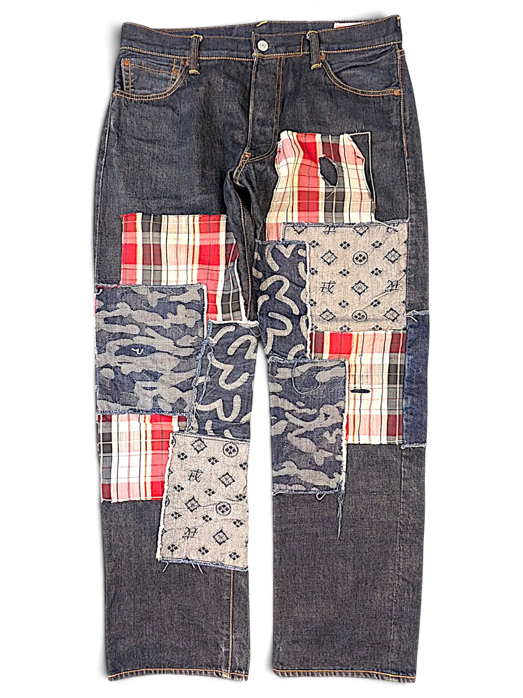 JAKE & IPI Evisu One Of One jeans featuring dark denim with mixed fabric patchwork, plaid, camo, and logo patterns.