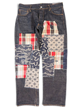 JAKE & IPI Evisu One Of One jeans featuring dark denim with mixed fabric patchwork, plaid, camo, and logo patterns.