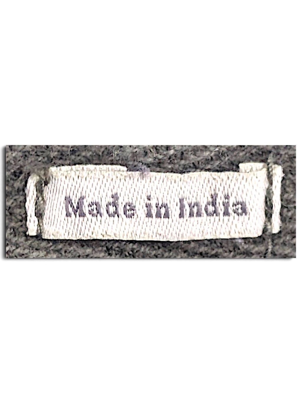 JAKE & IPI FatFace utility trousers fabric tag showing Made in India text on a dark olive green background