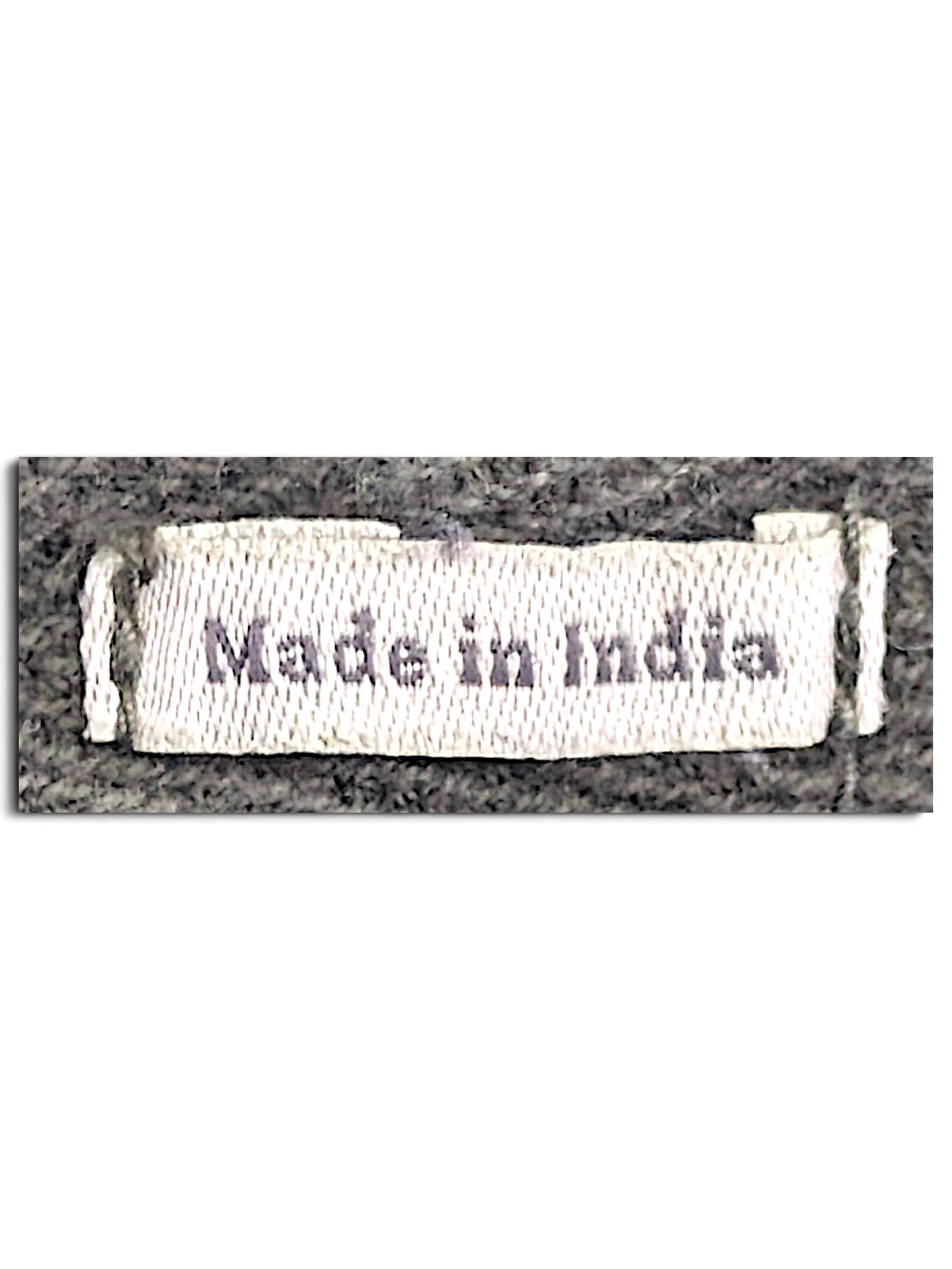 JAKE & IPI FatFace utility trousers fabric tag showing Made in India text on a dark olive green background
