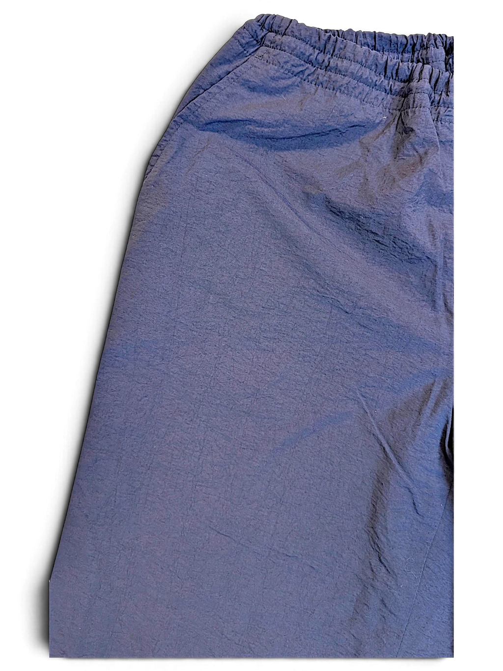 JAKE & IPI pre-owned Fila dark navy track pants with an elasticated waistband and textured fabric finish.