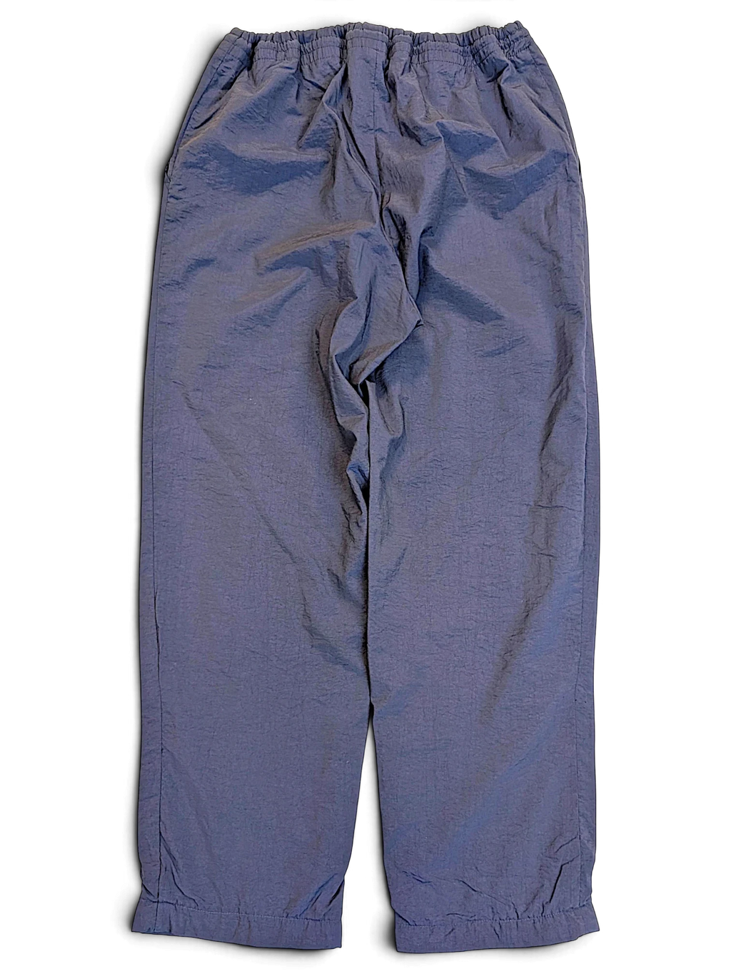 JAKE & IPI pre-owned Fila dark navy track pants with an elasticated waistband in good condition.