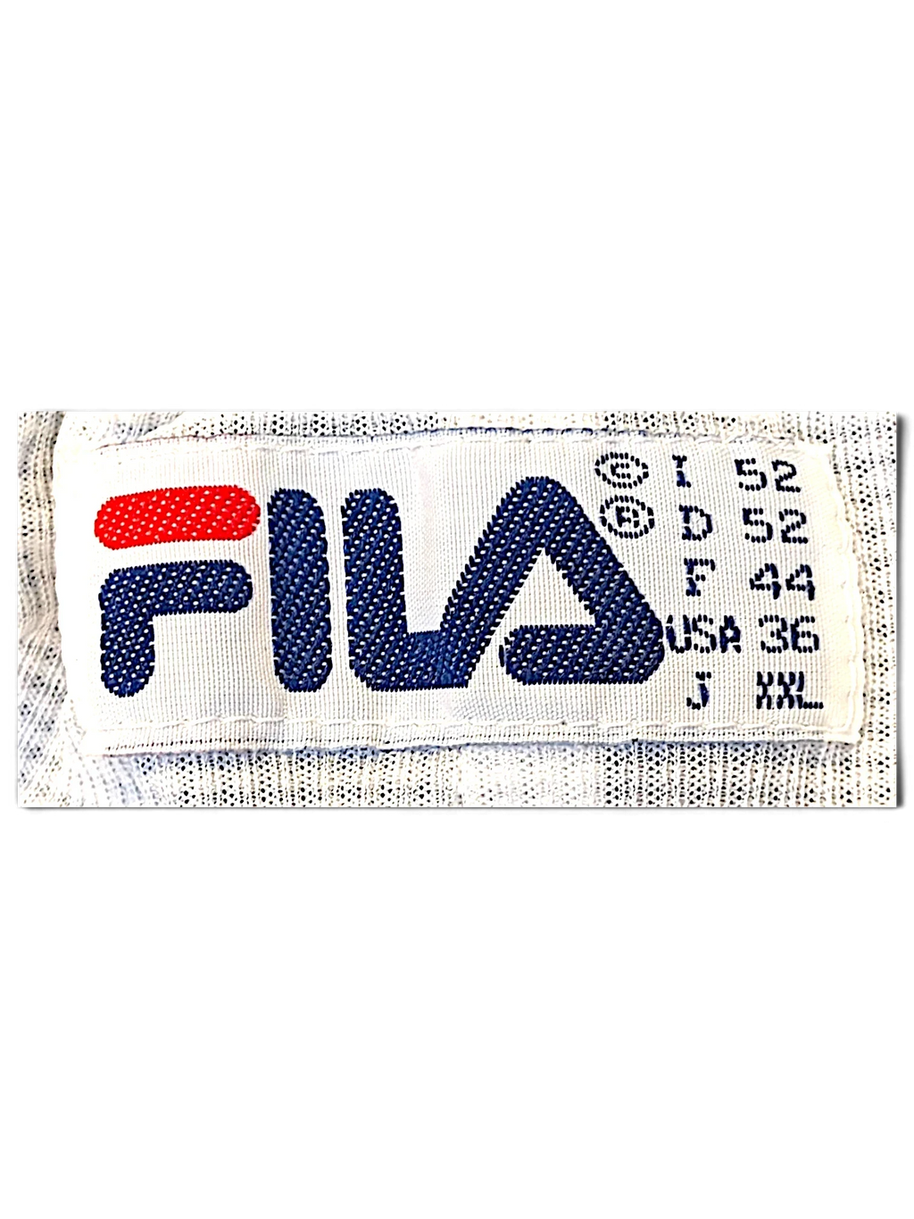 JAKE & IPI Fila track pants clothing label showing brand logo and international size specifications