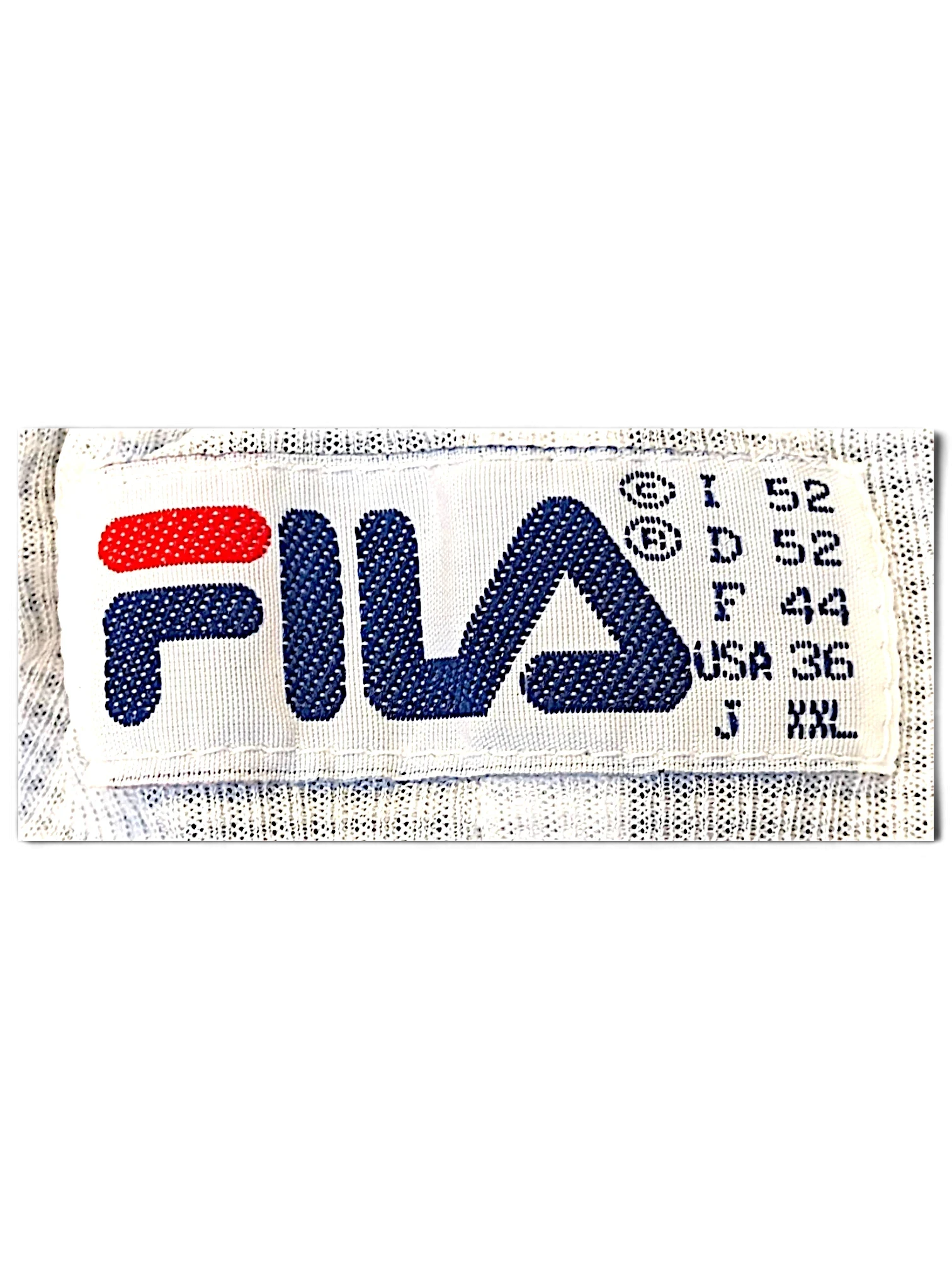 JAKE & IPI Fila track pants clothing label showing brand logo and international size specifications