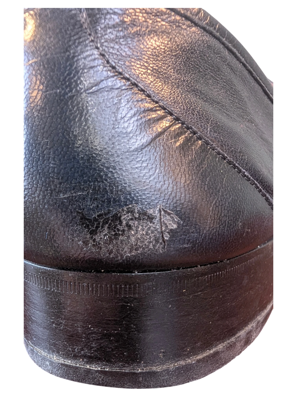JAKE & IPI Fratelli Rossetti black leather loafer heel showing surface wear and scuffing on the leather upper