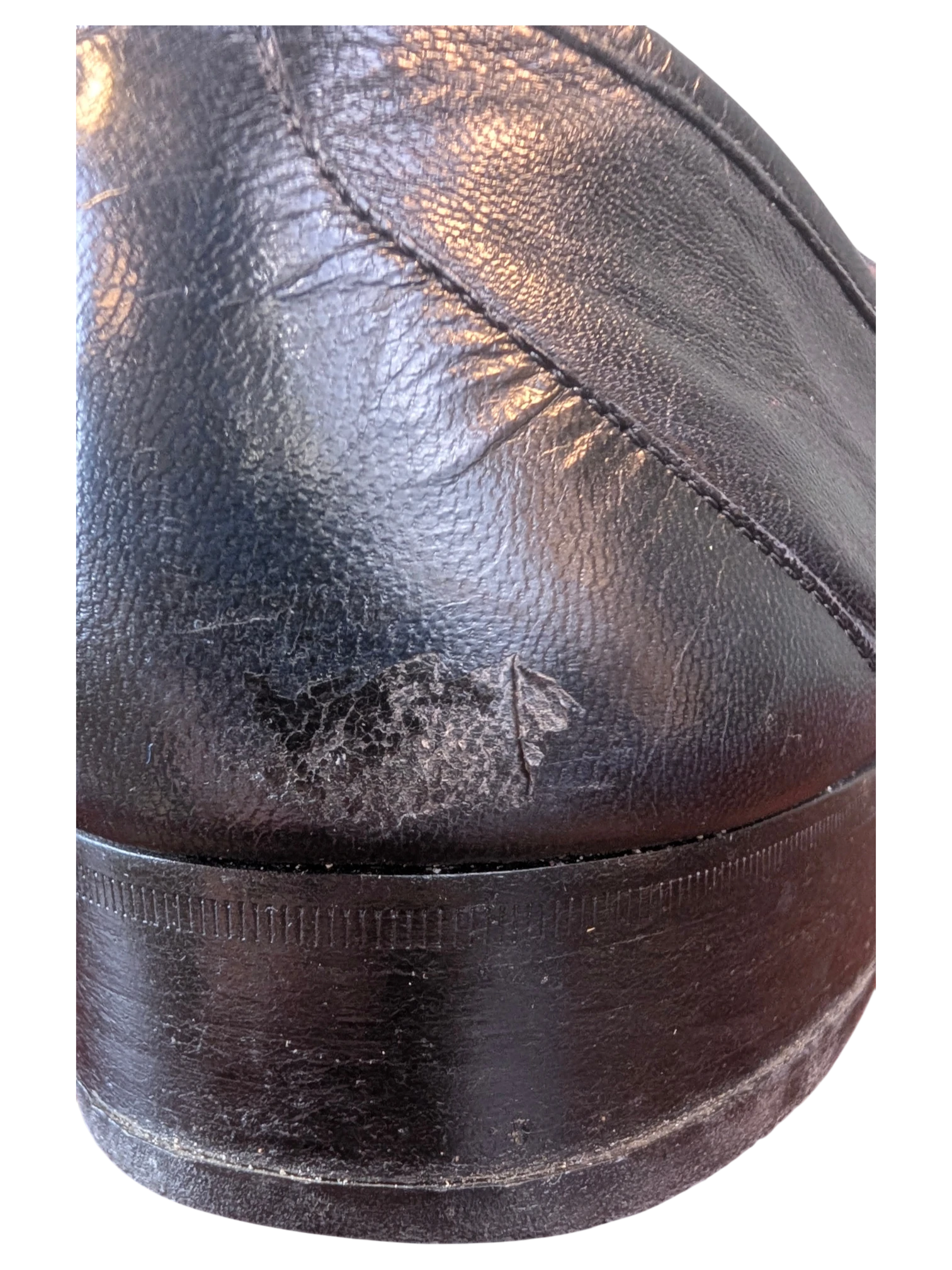 JAKE & IPI Fratelli Rossetti black leather loafer heel showing surface wear and scuffing on the leather upper