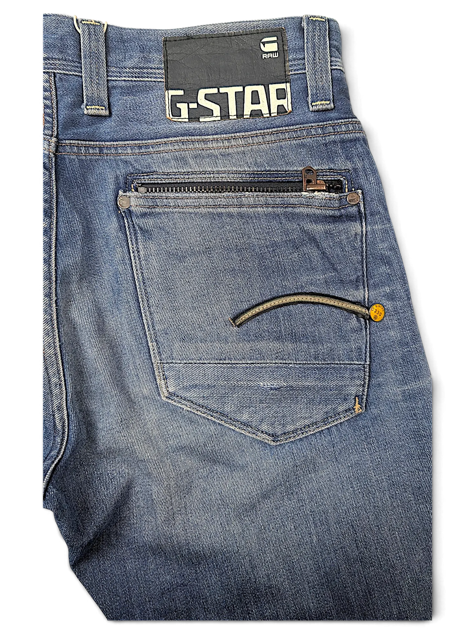 JAKE & IPI G-Star jeans in blue denim featuring a back pocket with a zipper and signature logo patch.