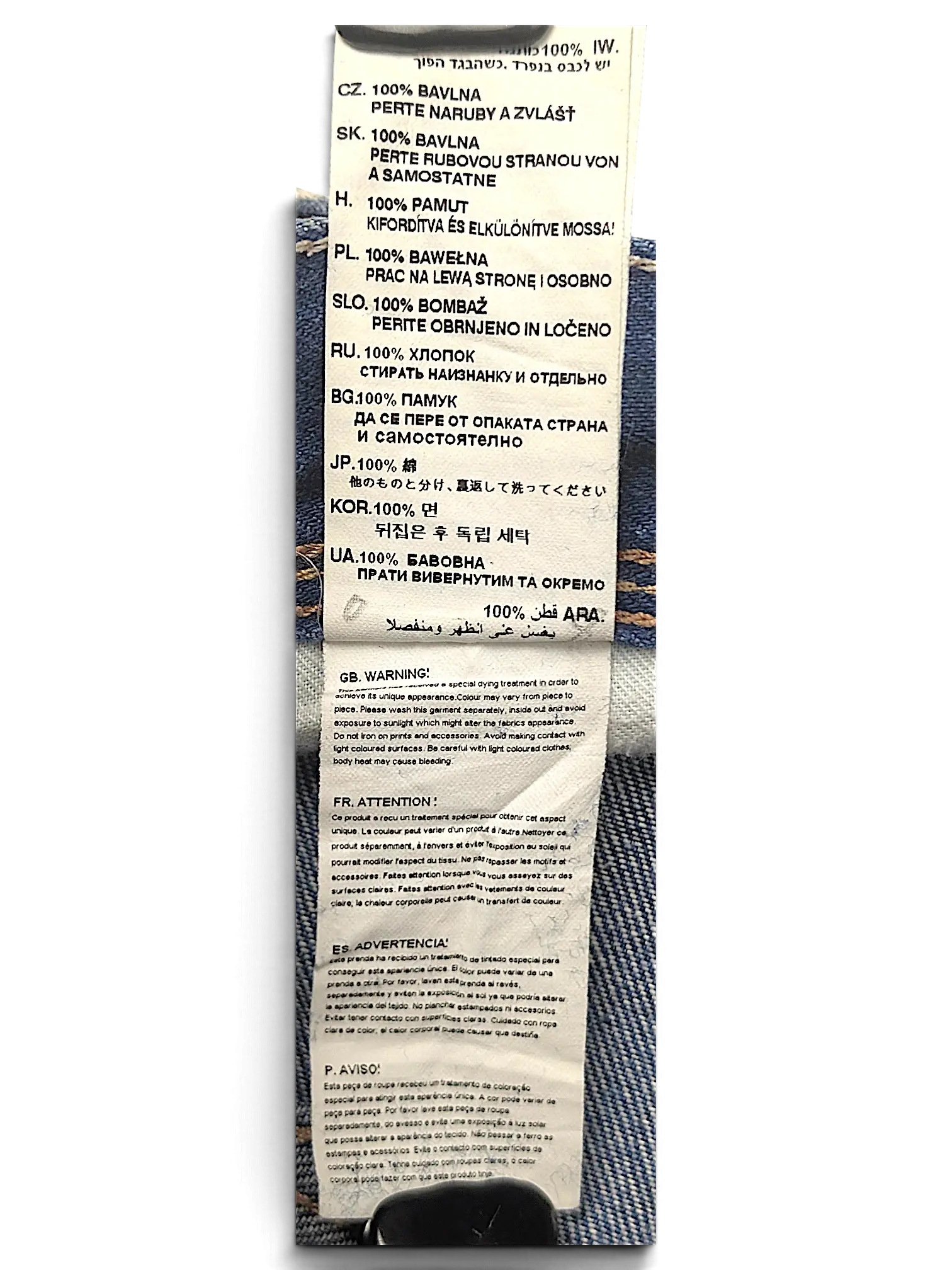 JAKE & IPI G-Star jeans interior care label with 100 percent cotton composition and multi-language washing instructions
