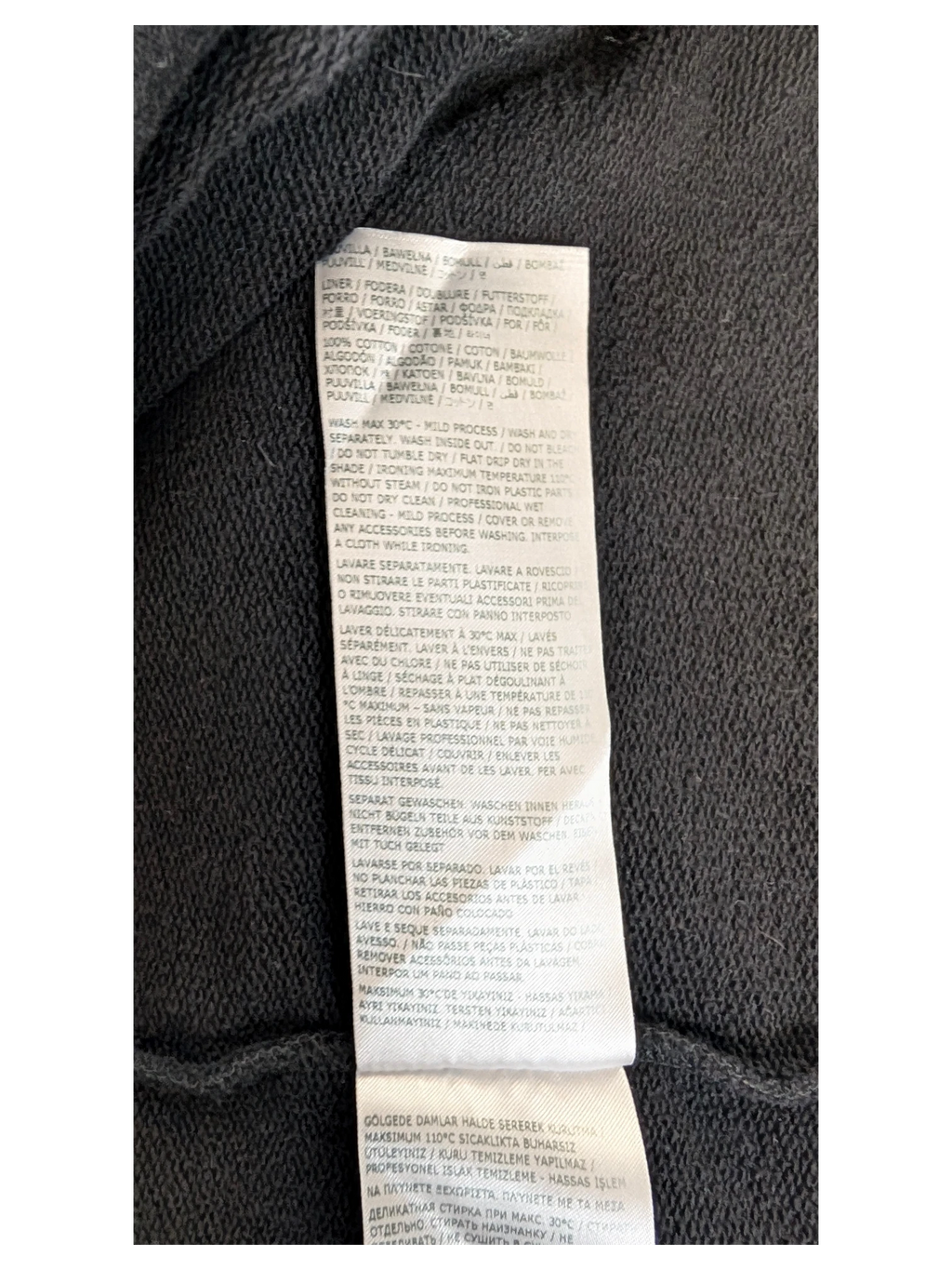 JAKE & IPI IBE MM6 Lunar New Year garment care label with 100% cotton composition and washing instructions