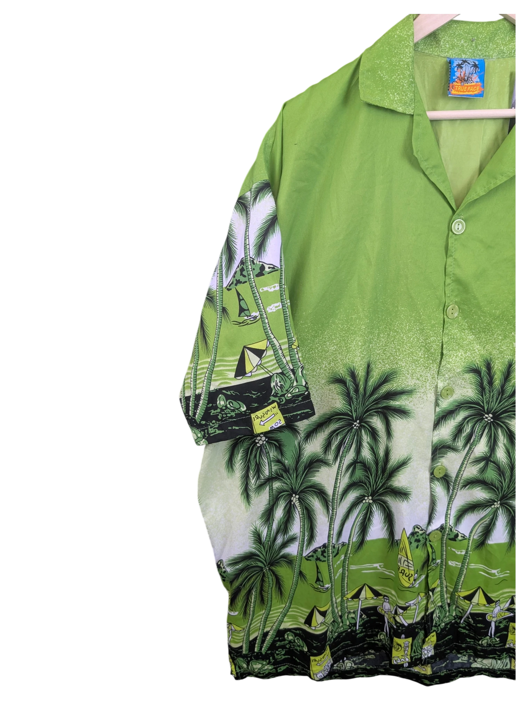 JAKE & IPI True Face green Hawaiian shirt featuring a tropical palm tree and beach print with button-down front.