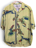 JAKE & IPI green Hawaiian shirt with a textured fabric, button-down front, and abstract tropical leaf patterns.