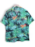JAKE & IPI Fight The Wall Hawaiian shirt in green with a tropical palm tree, ocean, and floral sunset print.