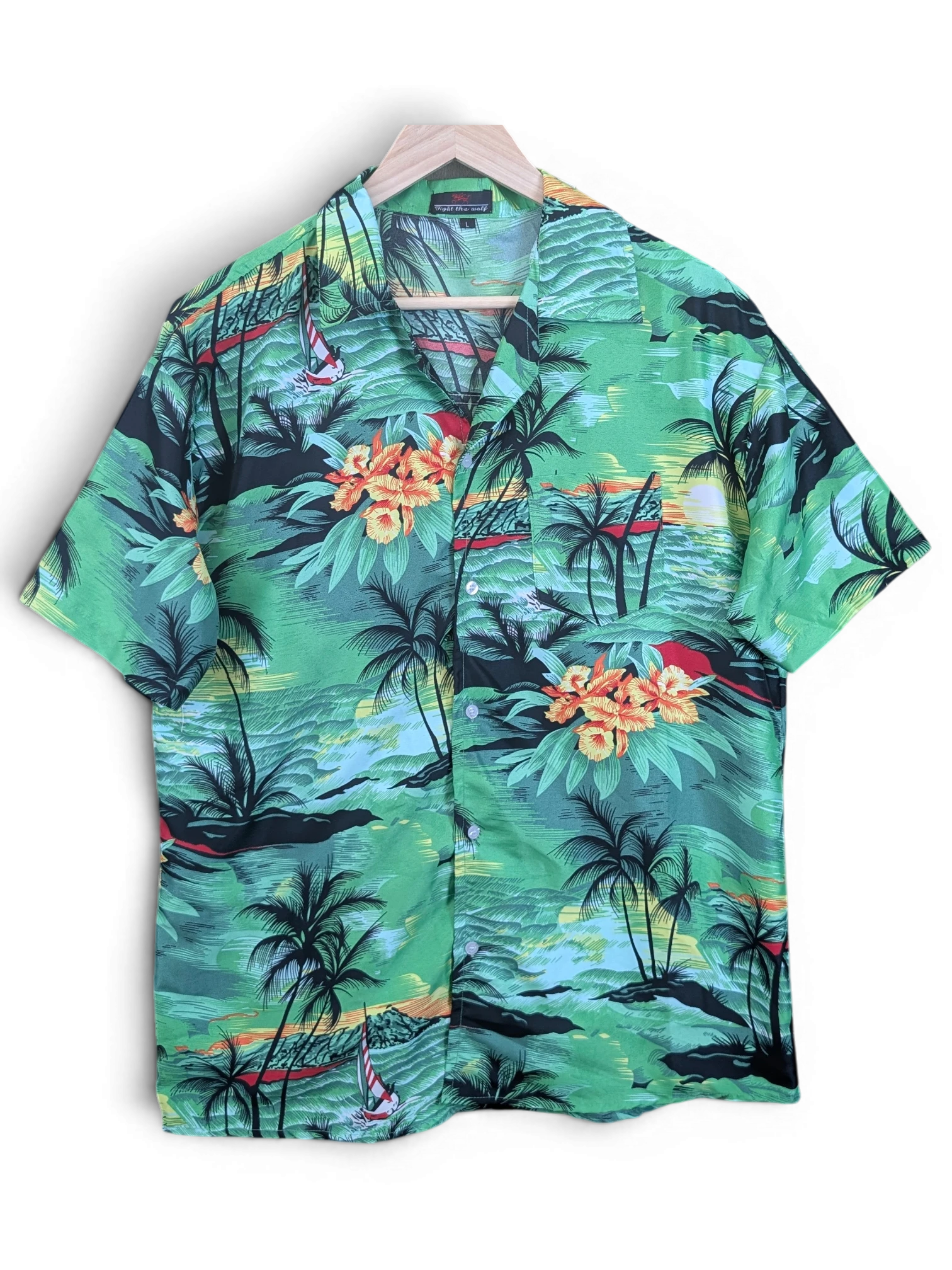 JAKE & IPI Fight The Wall Hawaiian shirt in green with a tropical palm tree, ocean, and floral sunset print.