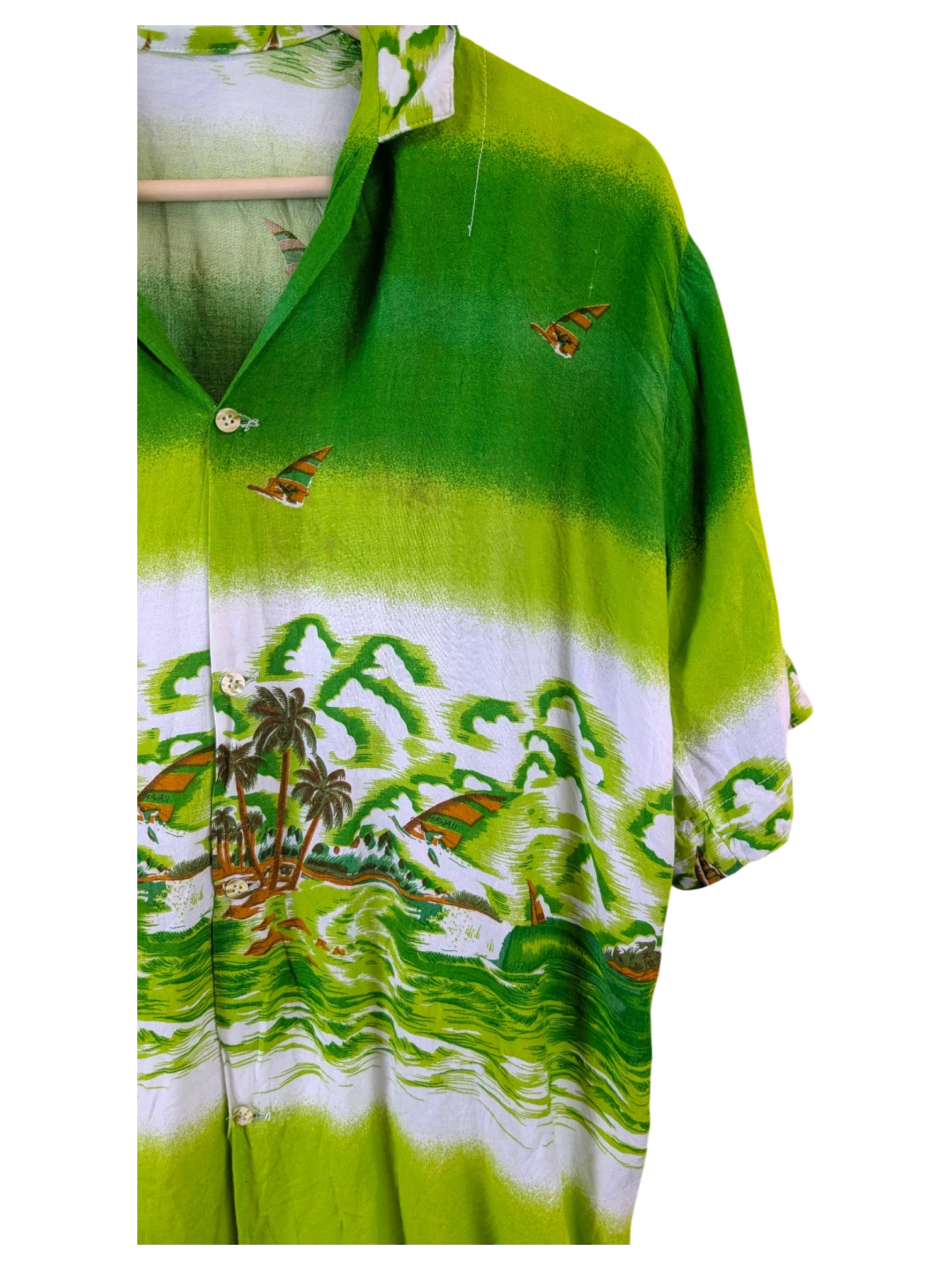 JAKE & IPI green Hawaiian shirt featuring a tropical landscape print with palm trees and sailboats