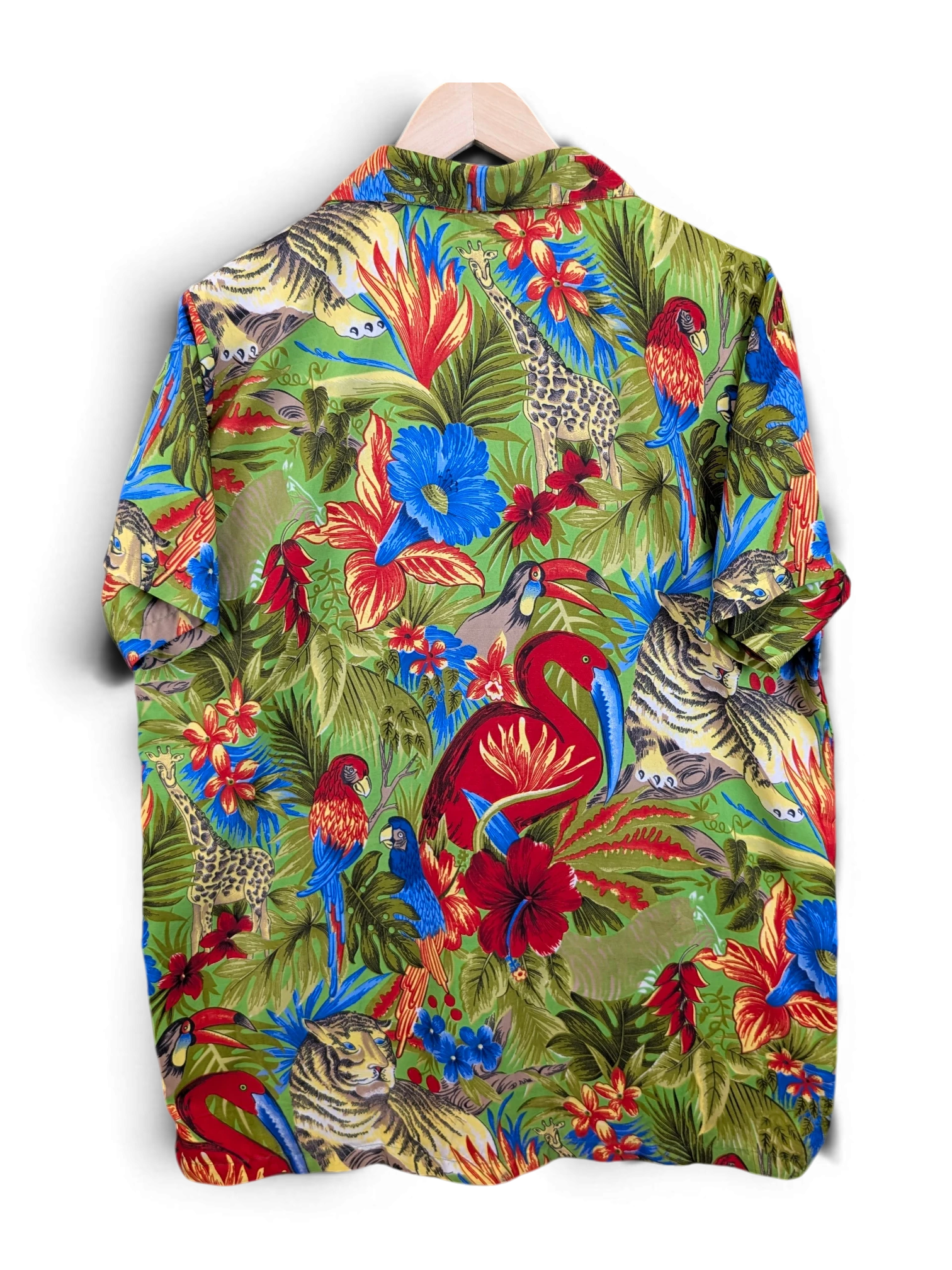 JAKE & IPI Hawaiian shirt featuring a vibrant green jungle print with tigers, giraffes, flamingos, and parrots.