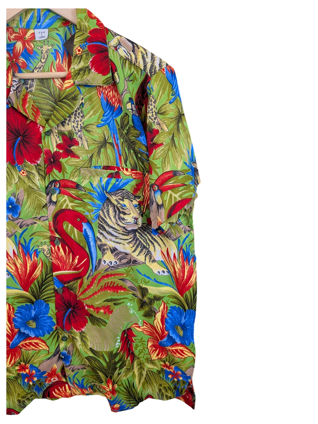 JAKE & IPI V.H.O Hawaiian shirt featuring a vibrant green jungle print with tigers, flamingos, and tropical flowers.
