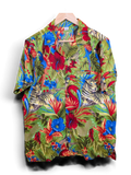 JAKE & IPI V.H.O Hawaiian shirt featuring a vibrant green jungle print with tigers, flamingos, and tropical flowers.