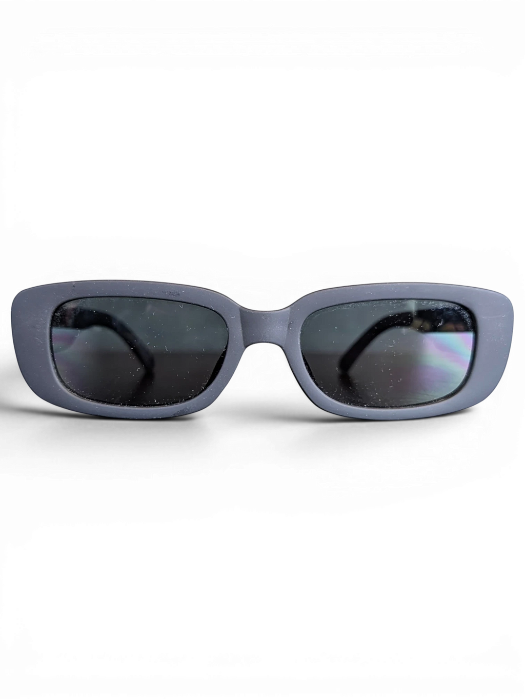 JAKE & IPI Sunkak sunglasses with a matte grey rectangular frame and dark tinted lenses on a black background.