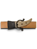 JAKE & IPI Griginialle leather belt featuring a unique horn-shaped buckle with dark metal hardware on a black background