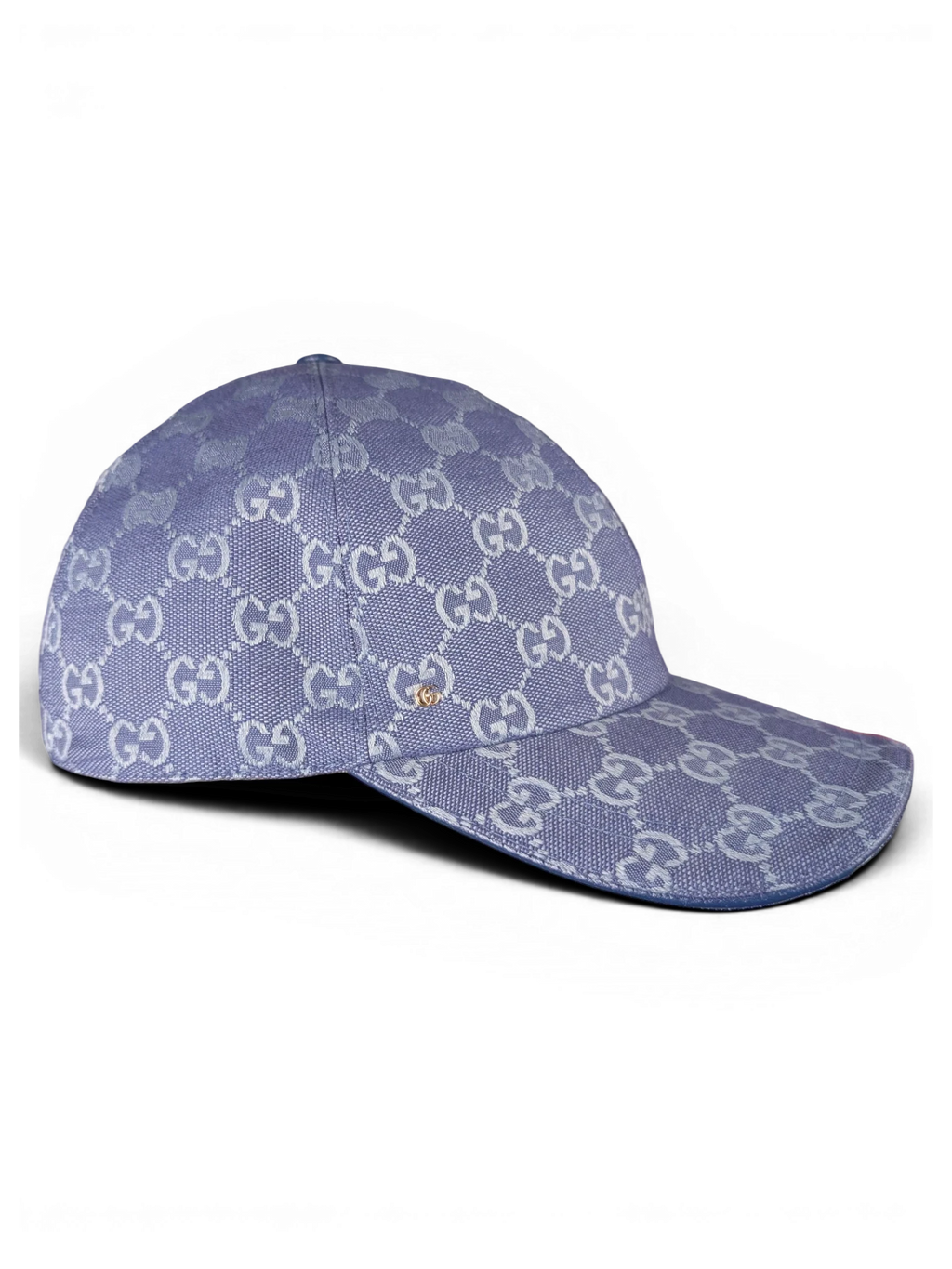 JAKE & IPI blue Gucci baseball cap with repeating monogram pattern and small gold-tone side detail.