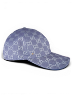 JAKE & IPI blue Gucci baseball cap with repeating monogram pattern and small gold-tone side detail.